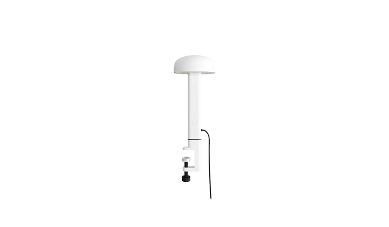 Lampe à pince blanche, Nod de Tiptoe, vue de côté mettant en avant le bras fin et la base, avec l’ampoule orientée vers le bas.