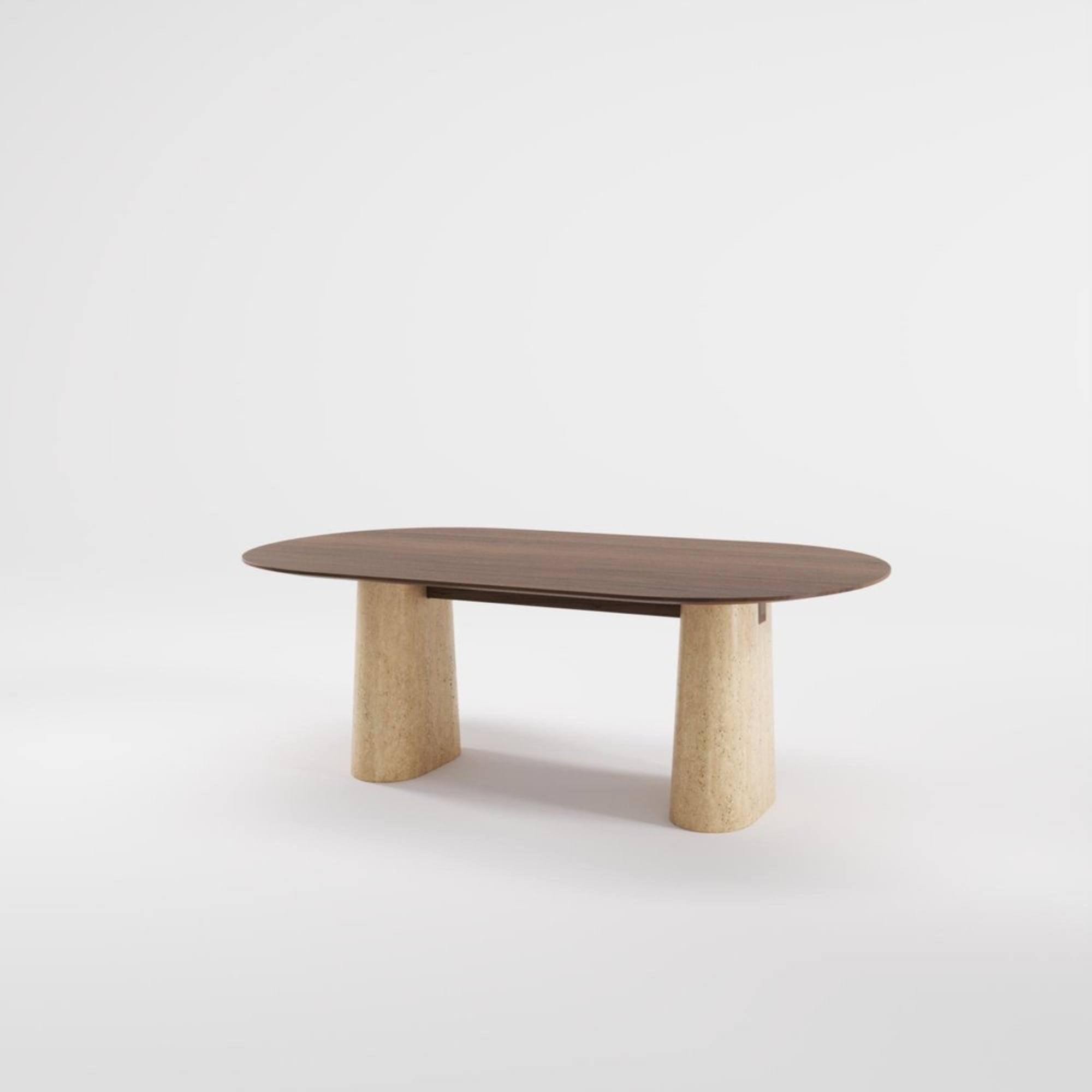 Table Anchor 200 cm en noyer et travertin massif, vue en angle sur fond blanc.