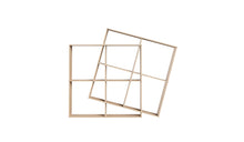Bibliothèque X2 de Wewood en bois clair, vue inclinée sur structure géométrique moderne à niches carrées, fond blanc épuré