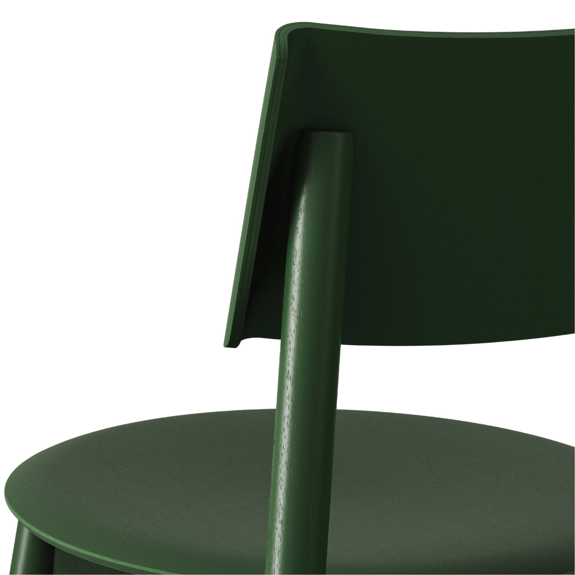 Gros plan sur l’assise et le dossier de la chaise SSD Full Wood de Tiptoe en chêne teinté vert, mettant en valeur la texture du bois et la qualité des finitions.
