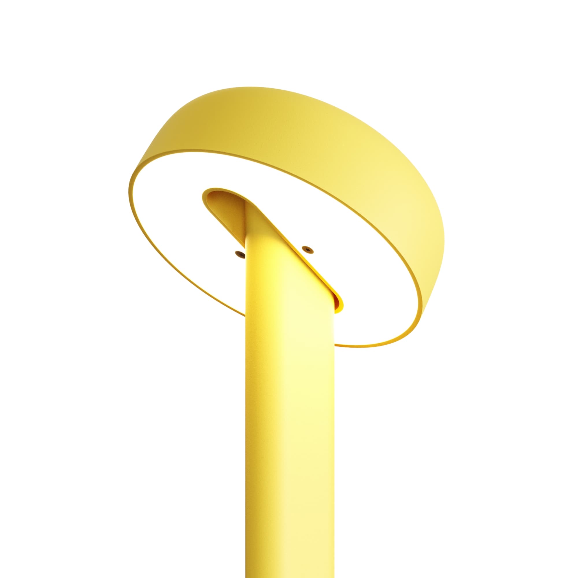 Lampe jaune, modèle Nod de Tiptoe, vue rapprochée de l’abat-jour circulaire, éclairage visible, avec la lumière dirigée vers le bas.