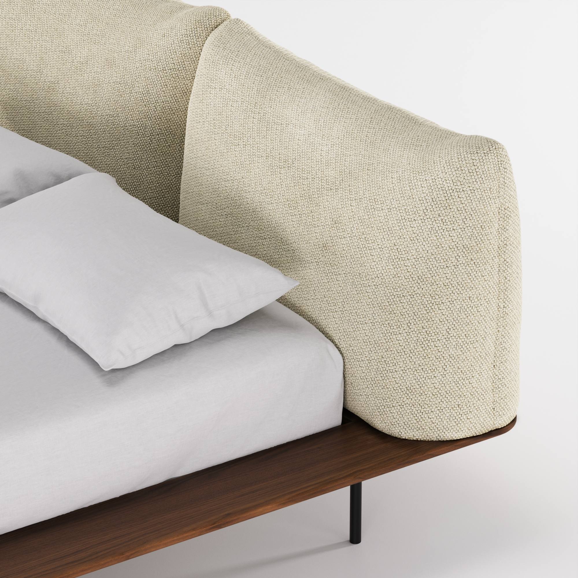Zoom sur la tête de lit Platform en coussins tissu écru, posée sur une base en noyer, vue rapprochée en angle.
