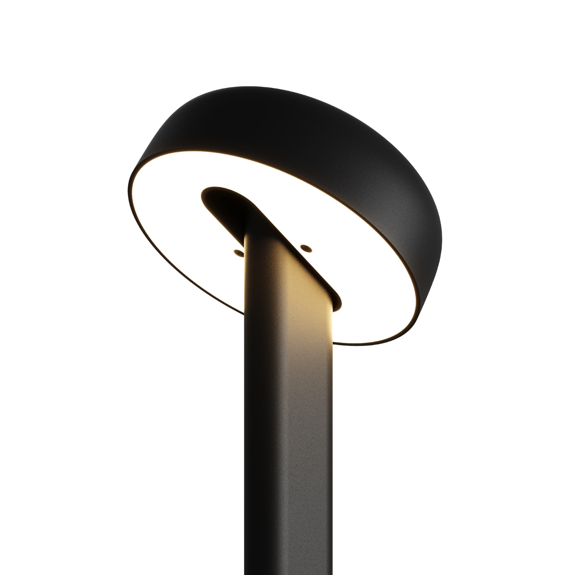 Lampe noire, modèle Nod de Tiptoe, vue rapprochée de l’abat-jour circulaire, éclairage visible, avec la lumière dirigée vers le bas.