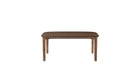 Vue en légère plongée de la table Soma 180 cm en chêne noyer, plateau ovale et structure fine, 6 à 8 places sur fond blanc
