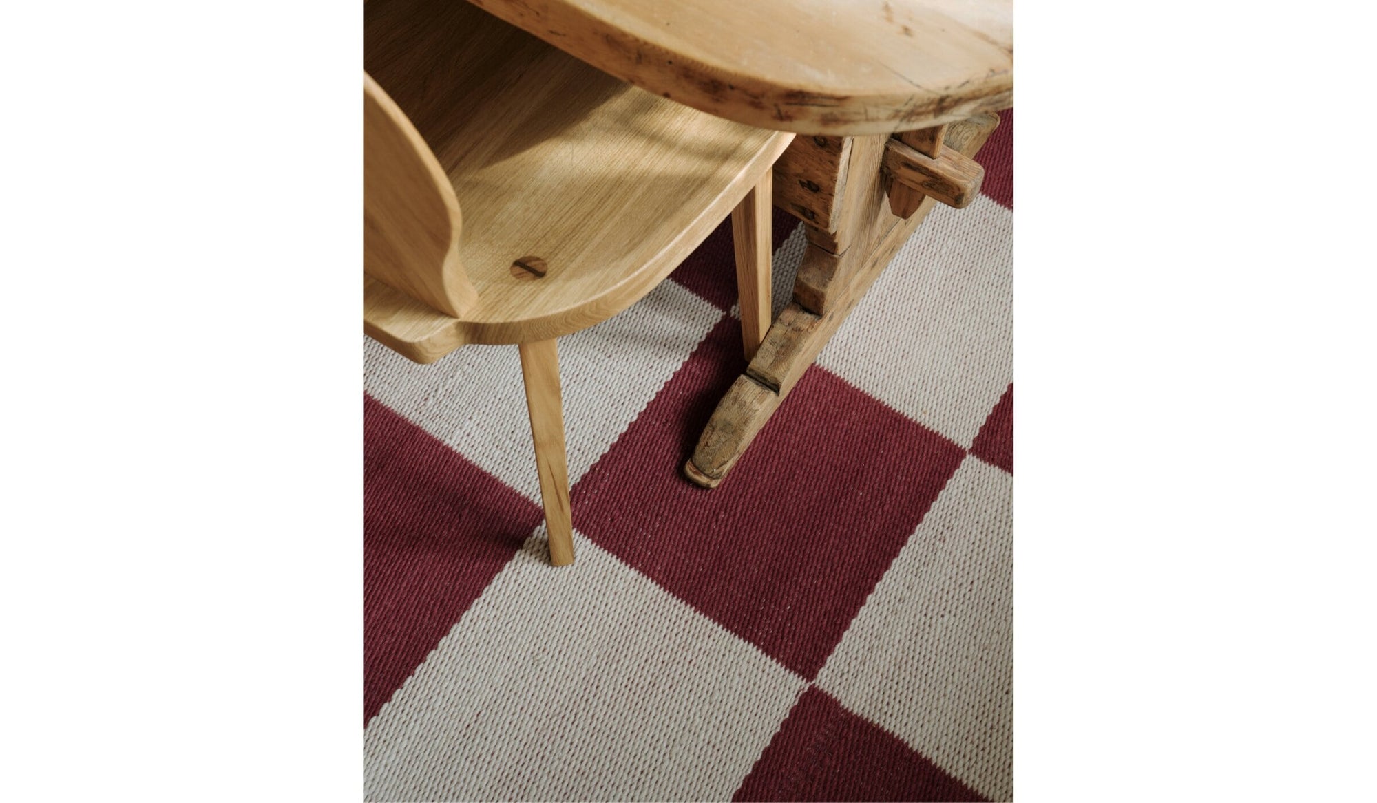 Red and white checkered Chess rug in natural wool