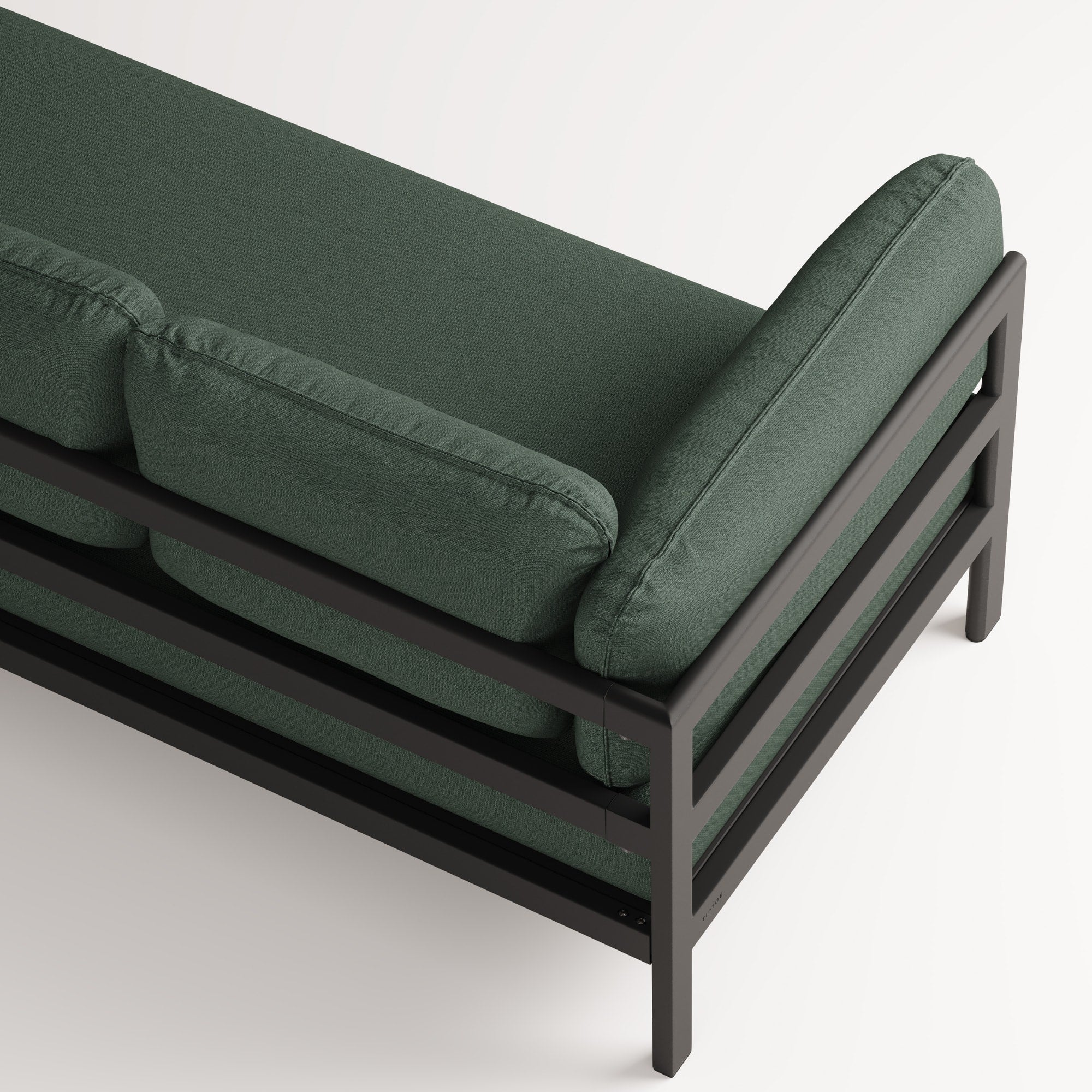Canapé Easy de Tiptoe en tissu vert, avec structure en métal noir et accoudoirs géométriques, capturé en vue du dessus rapprochée.